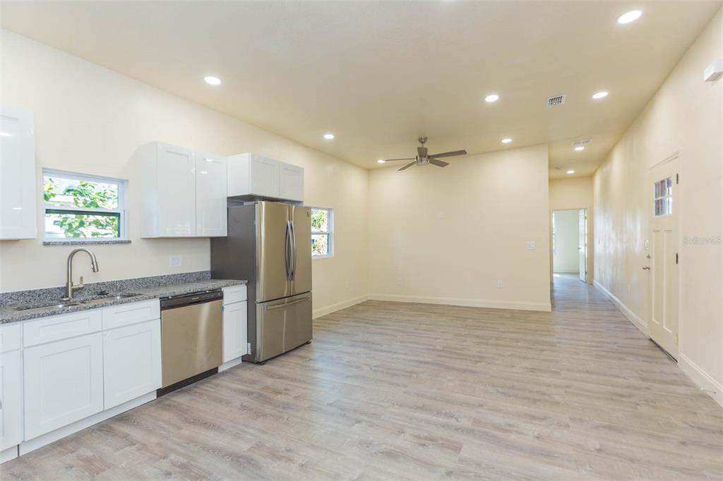 3008 North 17th Street Tampa, FL 33605 - Photo 3 of 28 a kitchen with a sink and refrigerator