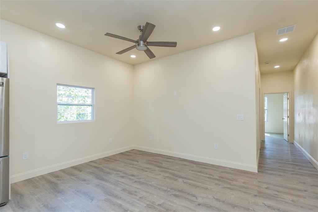 3008 North 17th Street Tampa, FL 33605 - Photo 6 of 28 an empty room with wooden floor closet and windows