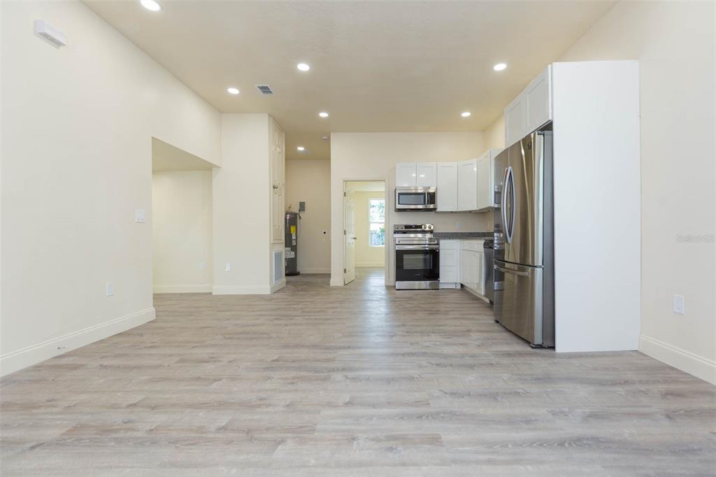 3008 North 17th Street Tampa, FL 33605 - Photo 8 of 28 a view of a kitchen with a sink and a refrigerator