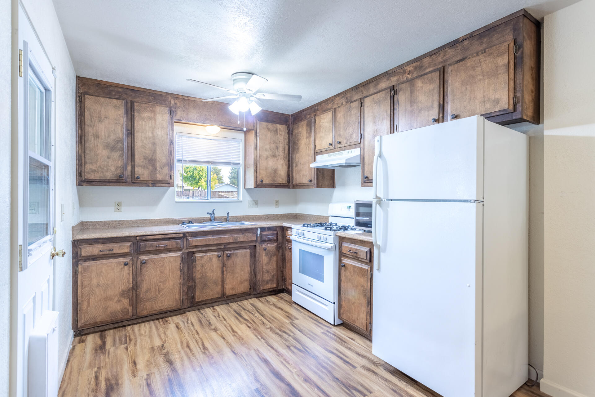 2472 Saturn Redding, CA 96002 - Photo 2 of 15 a kitchen with stainless steel appliances granite countertop a refrigerator sink and stove