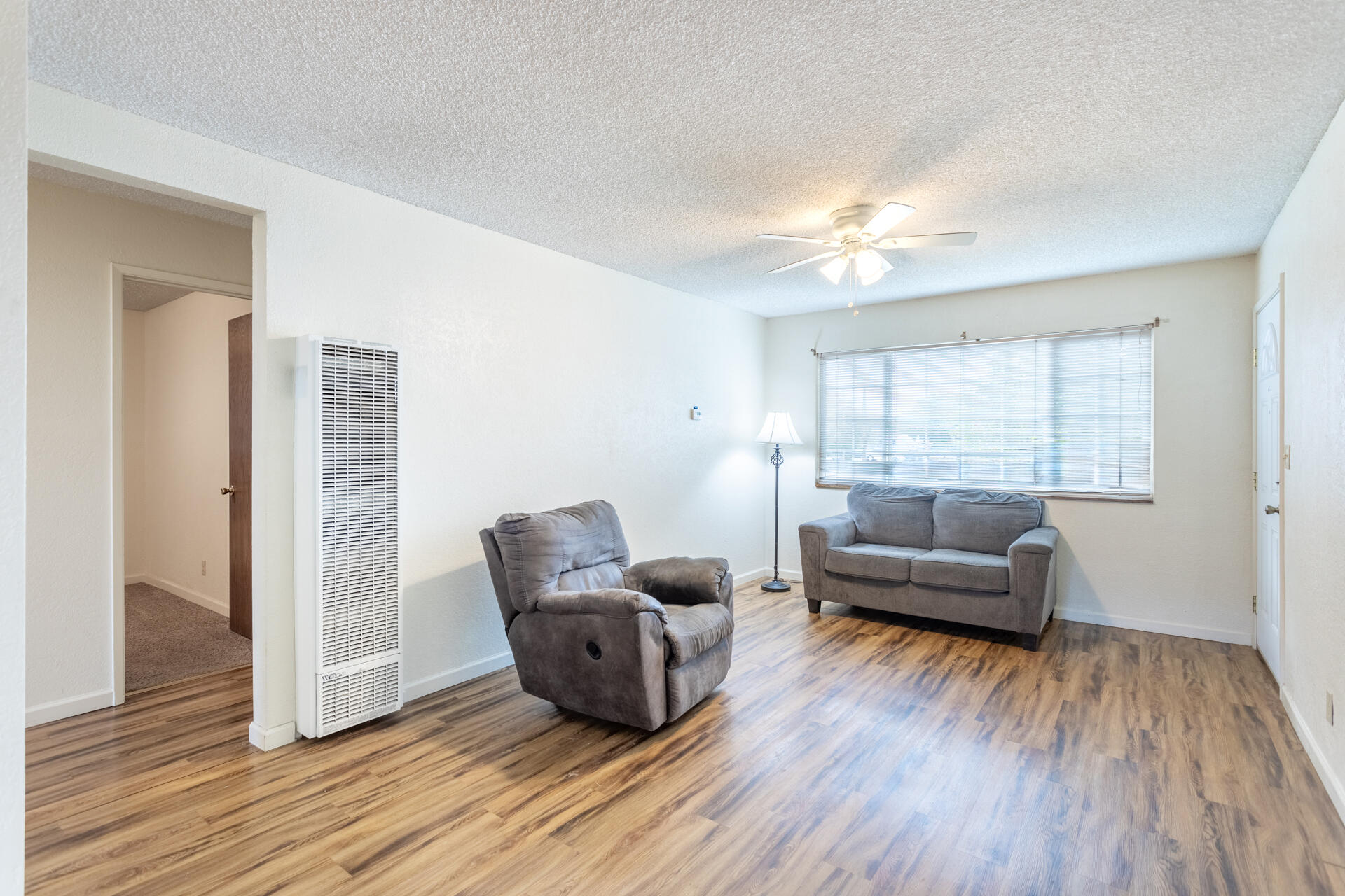 2472 Saturn Redding, CA 96002 - Photo 6 of 15 a living room with furniture and a wooden floor
