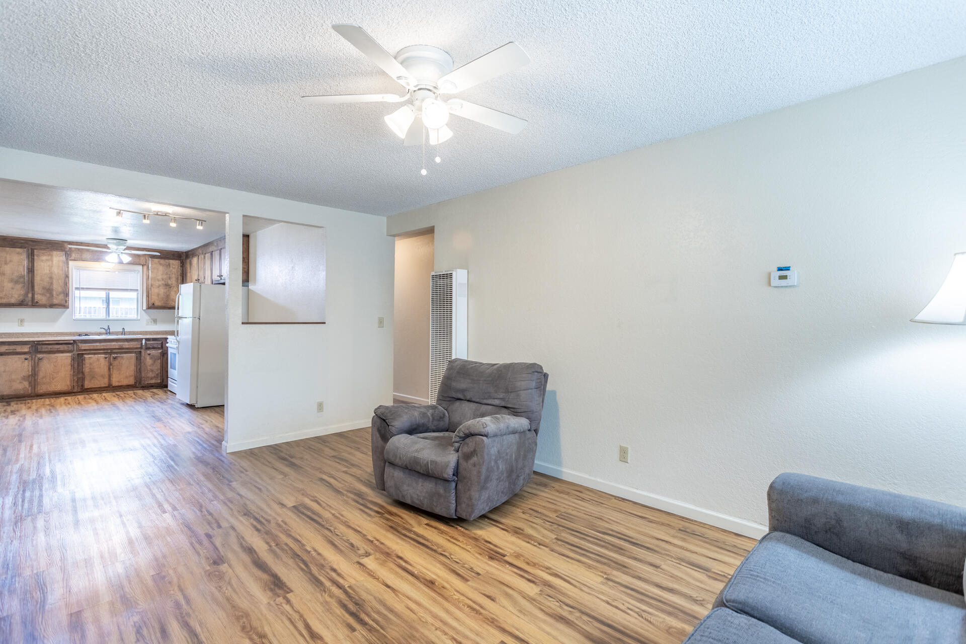 2472 Saturn Redding, CA 96002 - Photo 7 of 15 a living room with furniture and a wooden floor