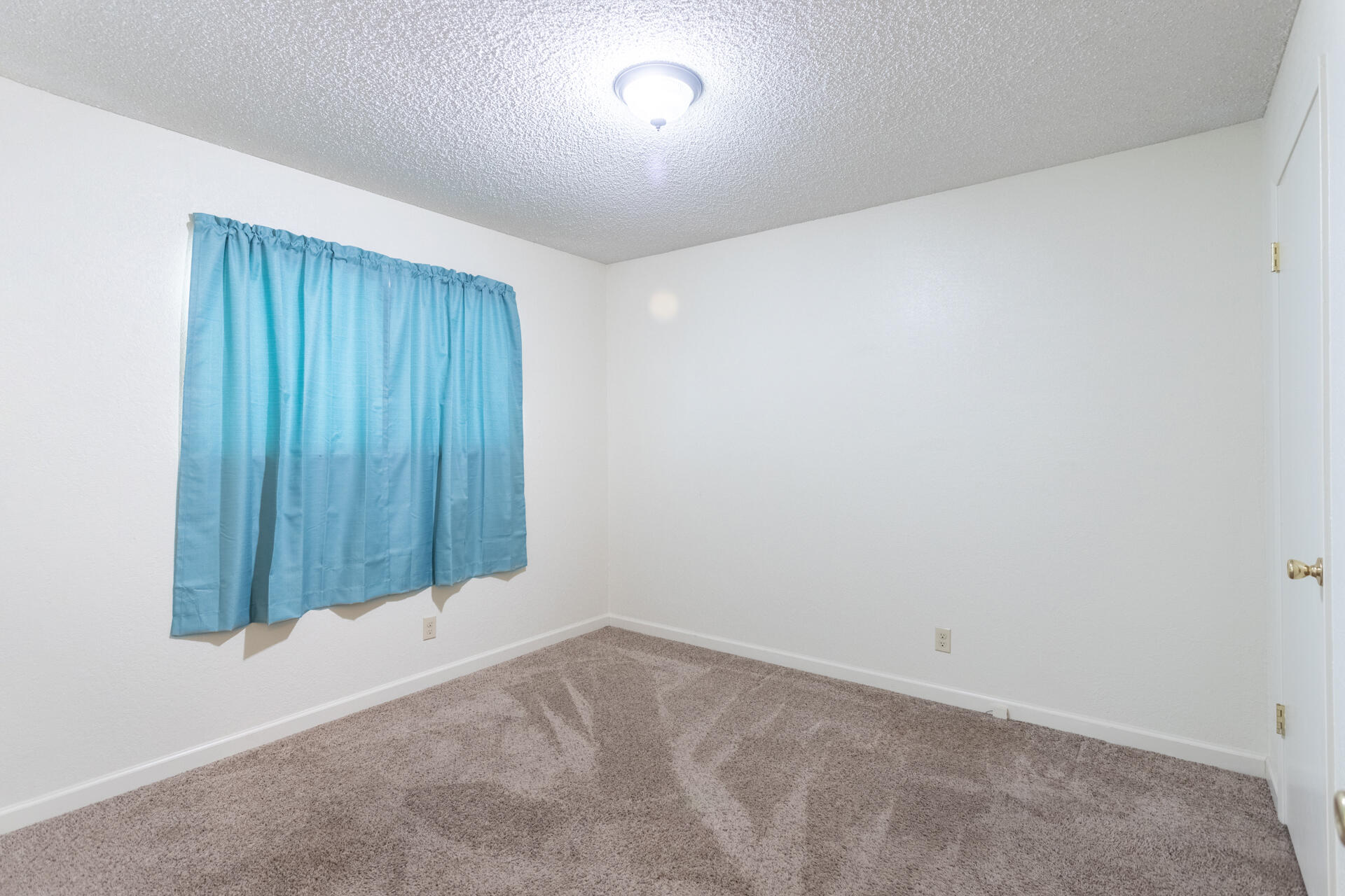 2472 Saturn Redding, CA 96002 - Photo 8 of 15 an empty room with a window