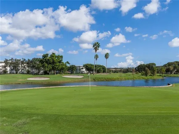 a view of a golf course with a lake view
