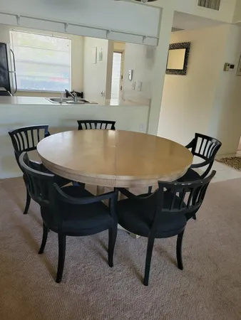 a view of a dining room with furniture and window
