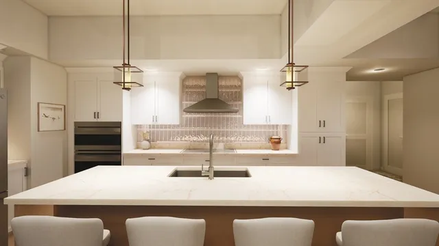 a view of a kitchen counter space a sink and appliances