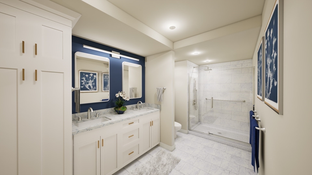 50 Balch Street, Unit 205 Beverly, MA 01915 - Photo 4 of 4 a bathroom with a granite countertop sink mirror and shower