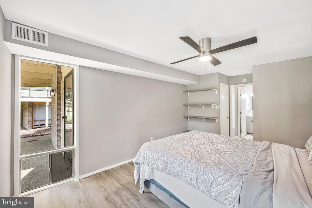 7129 Donnell Place, Unit A District Heights, MD 20747 - Photo 18 of 25 a bedroom with a large bed and a window