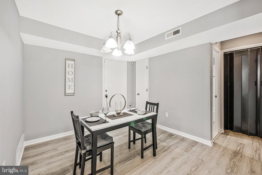 7129 Donnell Place, Unit A District Heights, MD 20747 - Photo 8 of 25 a view of a dining room with a table and chairs