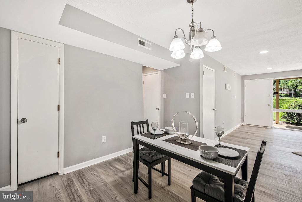7129 Donnell Place, Unit A District Heights, MD 20747 - Photo 9 of 25 a view of a dining room with a table and chairs