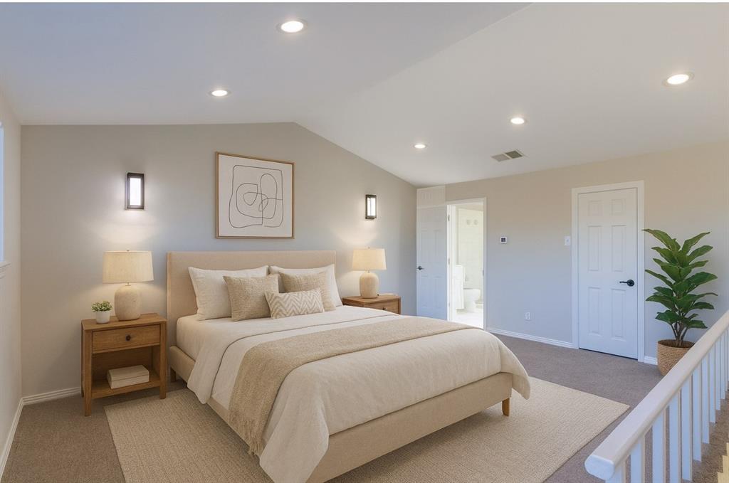 a bedroom with a large bed and potted plant