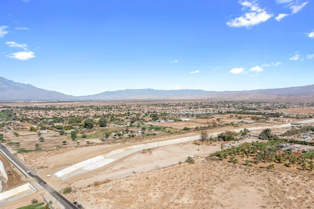 a view of an ocean beach and mountain
