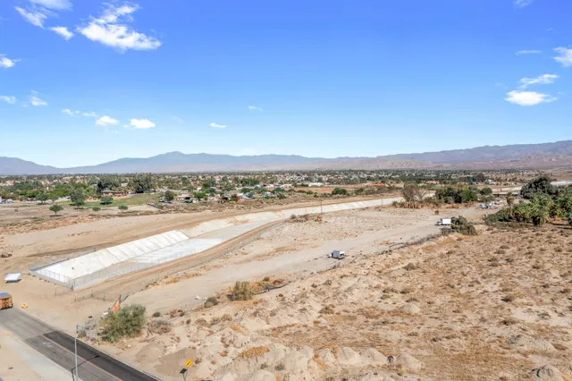 a view of an ocean beach and a mountain