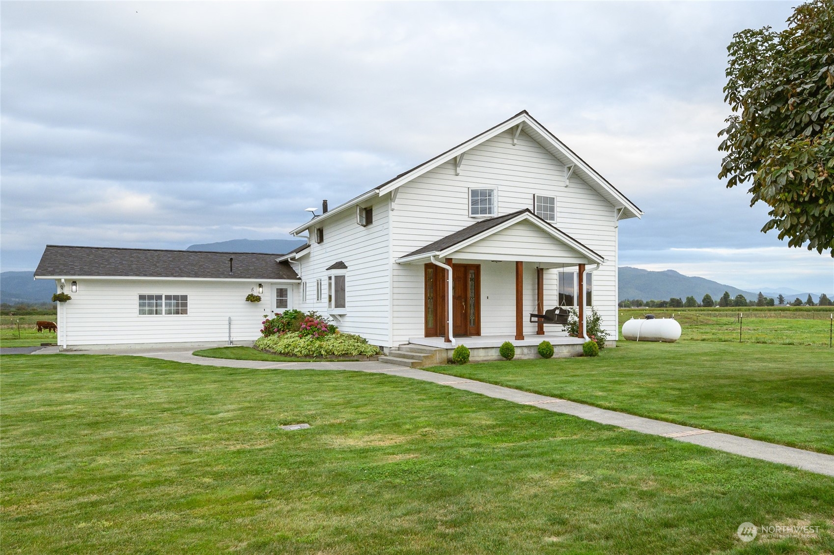 7956 Trapline Road Everson, WA 98247 - Photo 1 of 40 a front view of house with yard and green space