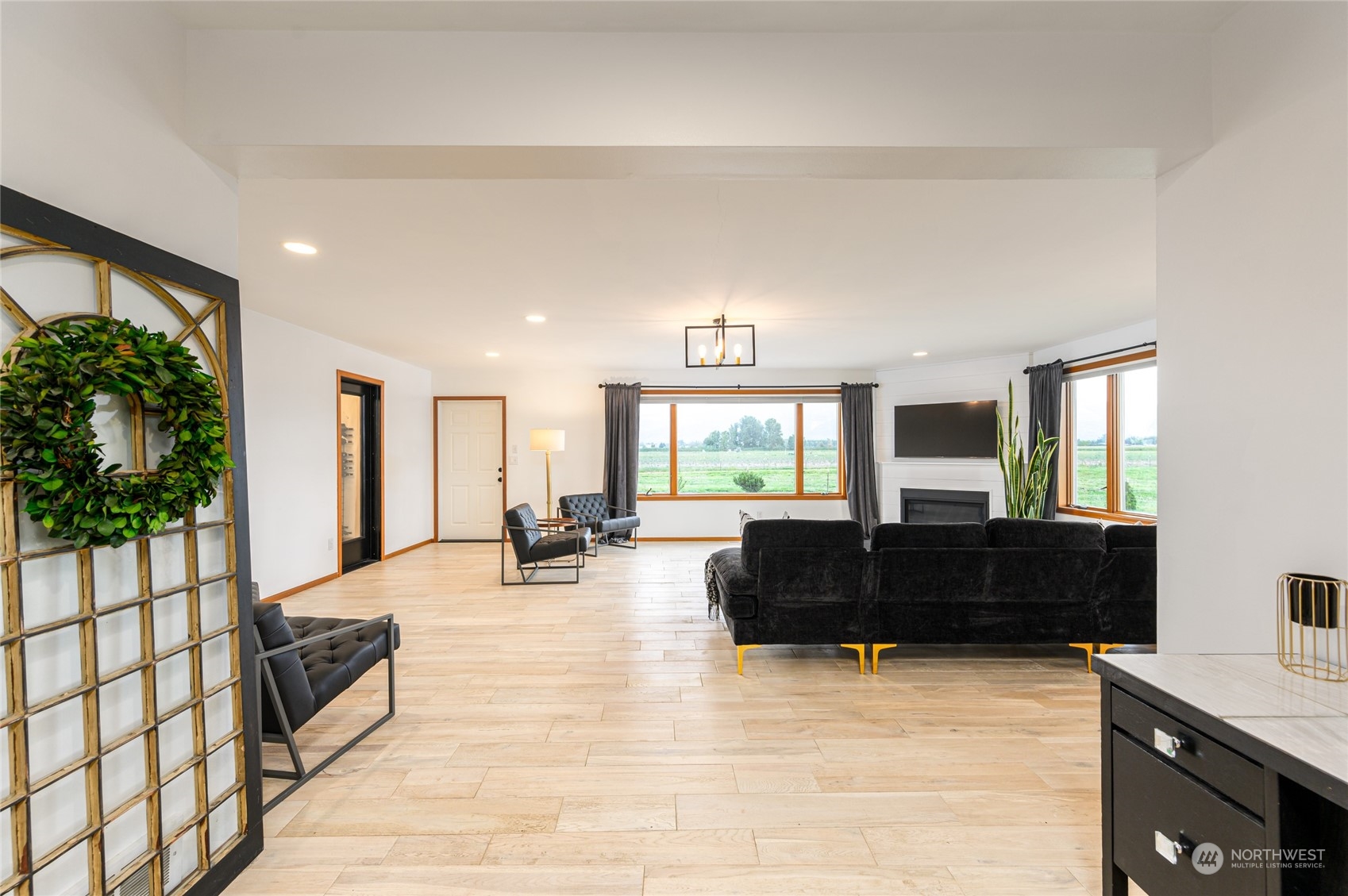 7956 Trapline Road Everson, WA 98247 - Photo 15 of 40 a living room with furniture and large windows