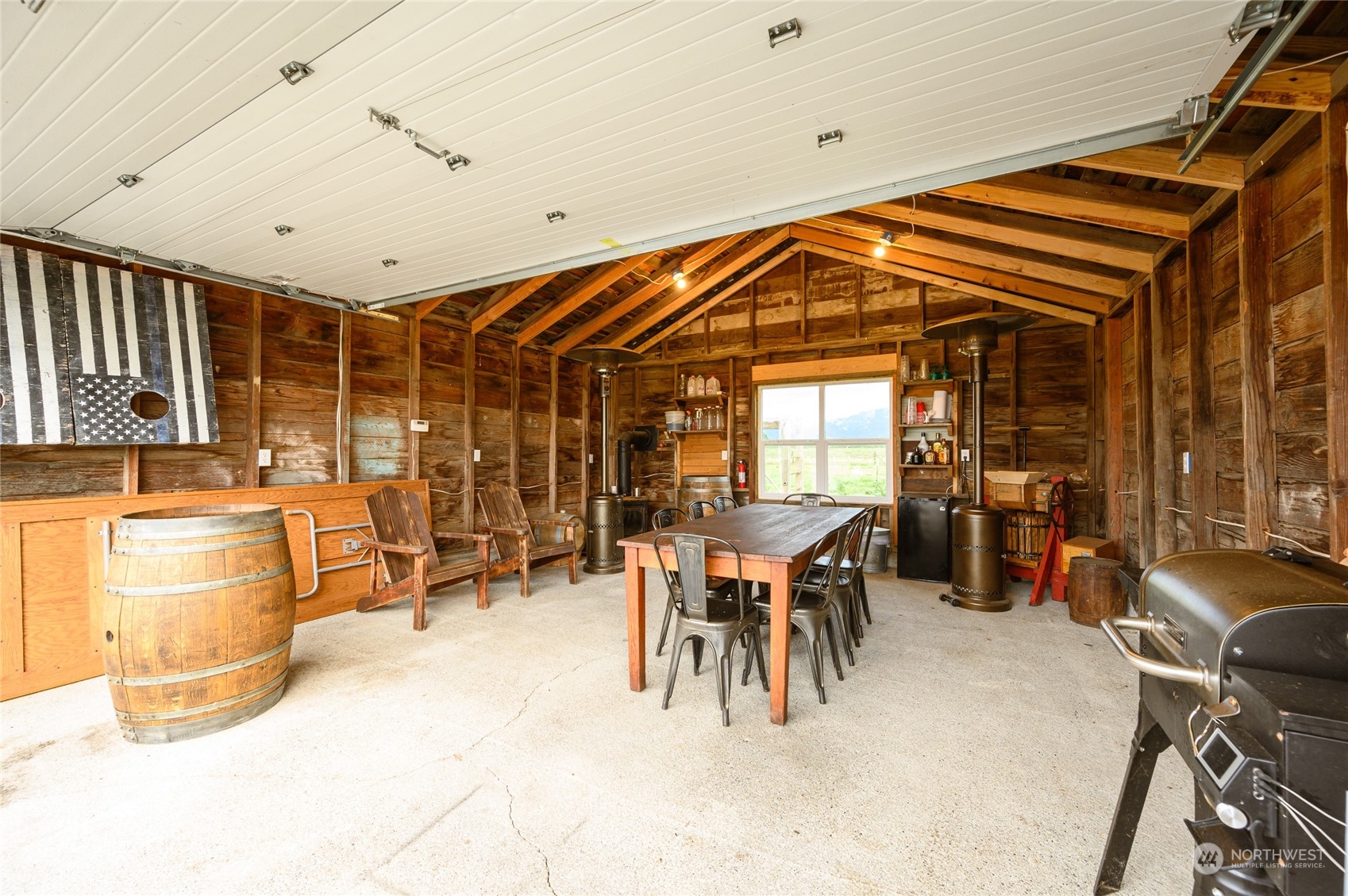 7956 Trapline Road Everson, WA 98247 - Photo 26 of 40 a dining room with furniture a chandelier and a window