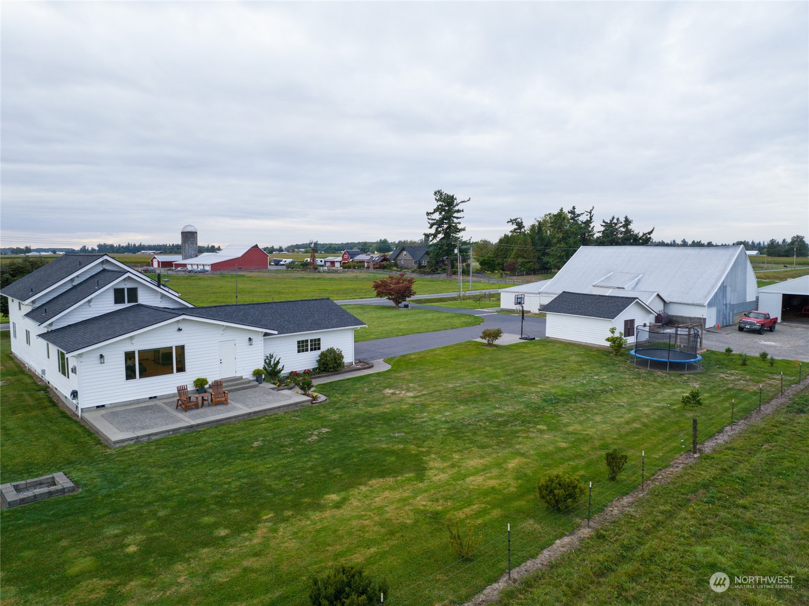 7956 Trapline Road Everson, WA 98247 - Photo 28 of 40 a aerial view of a house with table and chairs