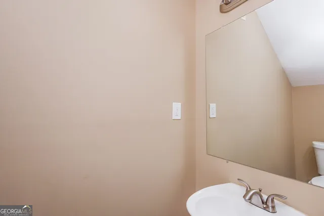 a bathroom with a sink and a toilet