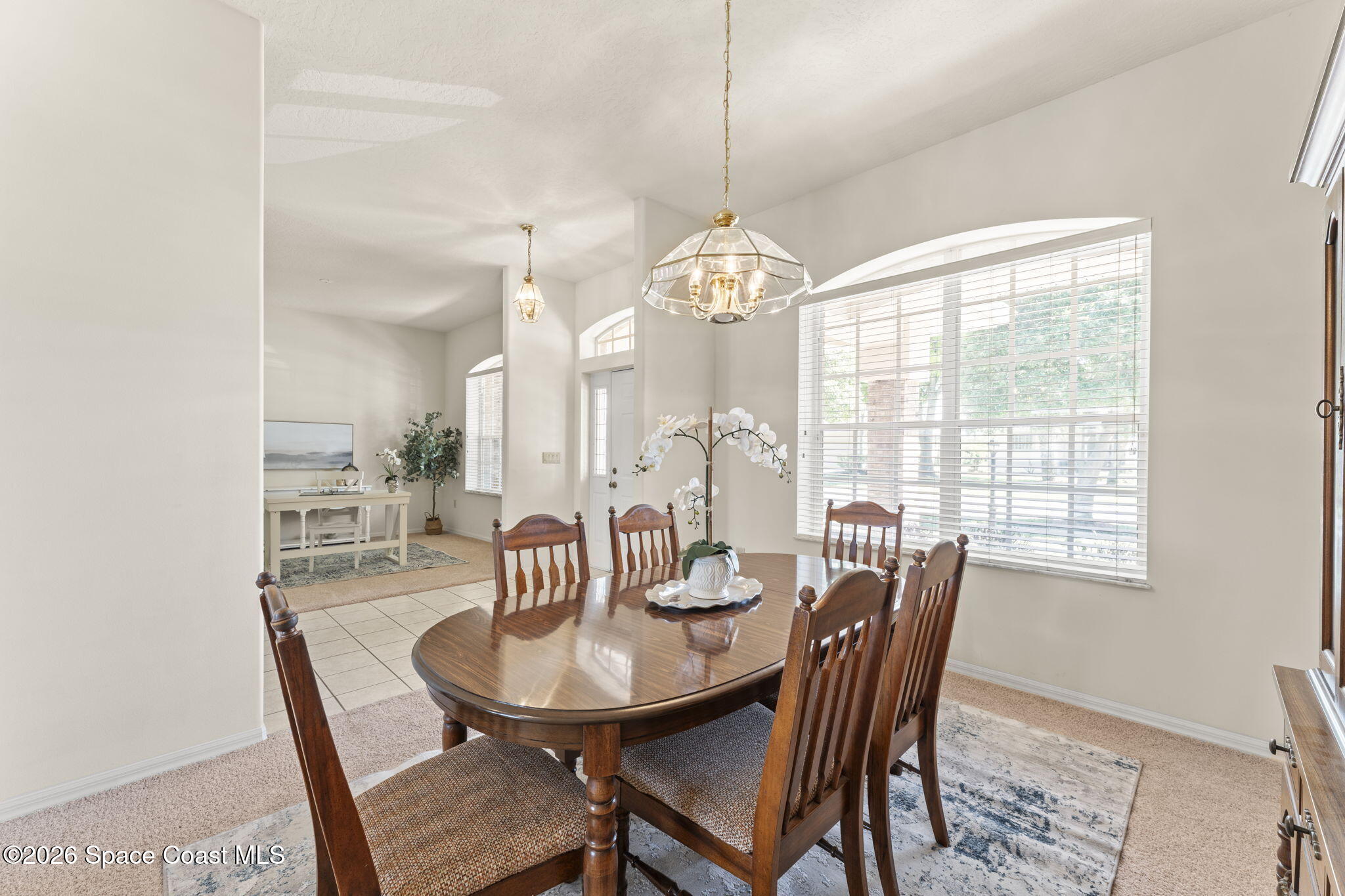 1123 Spring Oak Drive Melbourne, FL 32901 - Photo 14 of 67 a view of a dining room with furniture window and outside view
