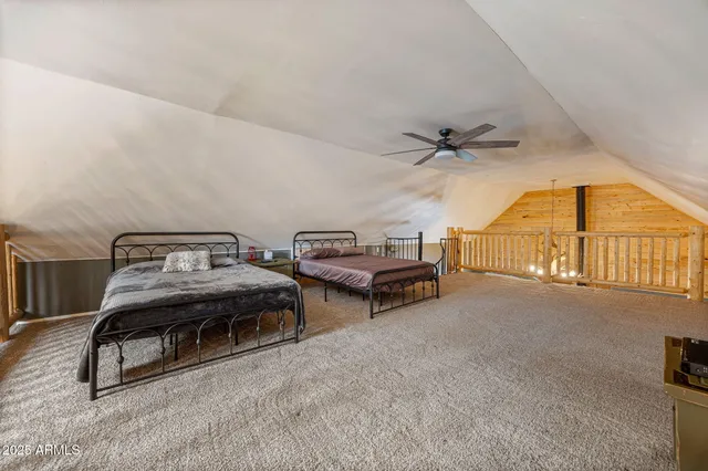 a view of a livingroom with furniture and a ceiling fan