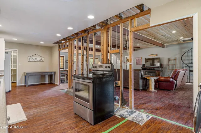 a kitchen with stainless steel appliances granite countertop a stove and a refrigerator