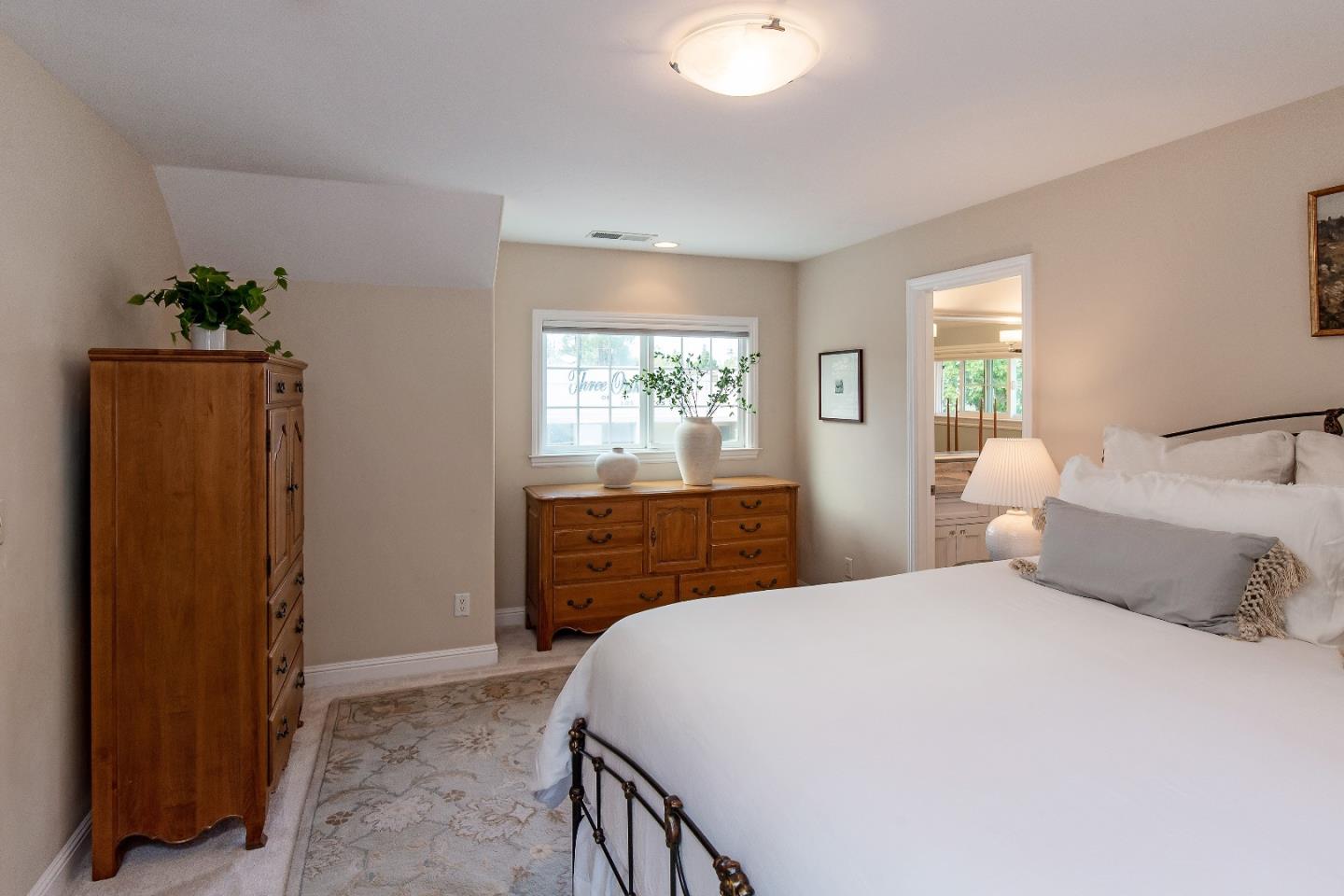 88 Forrest Avenue Los Gatos, CA 95032 - Photo 14 of 26 a bedroom with a large bed and wooden floor