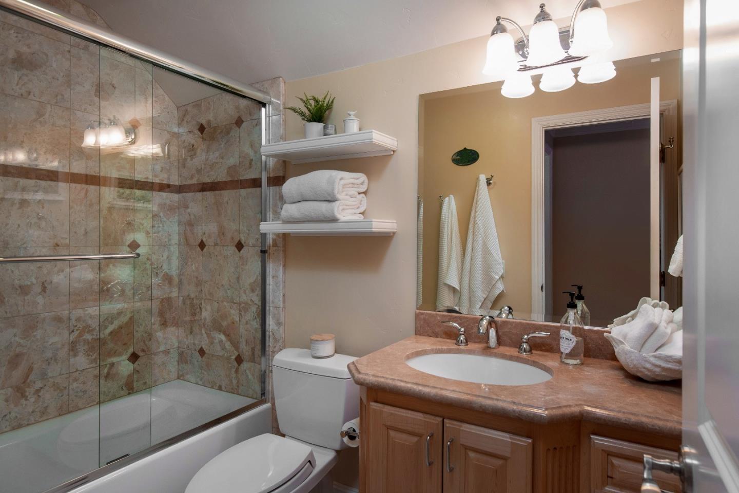 88 Forrest Avenue Los Gatos, CA 95032 - Photo 18 of 26 a bathroom with a granite countertop sink toilet and shower