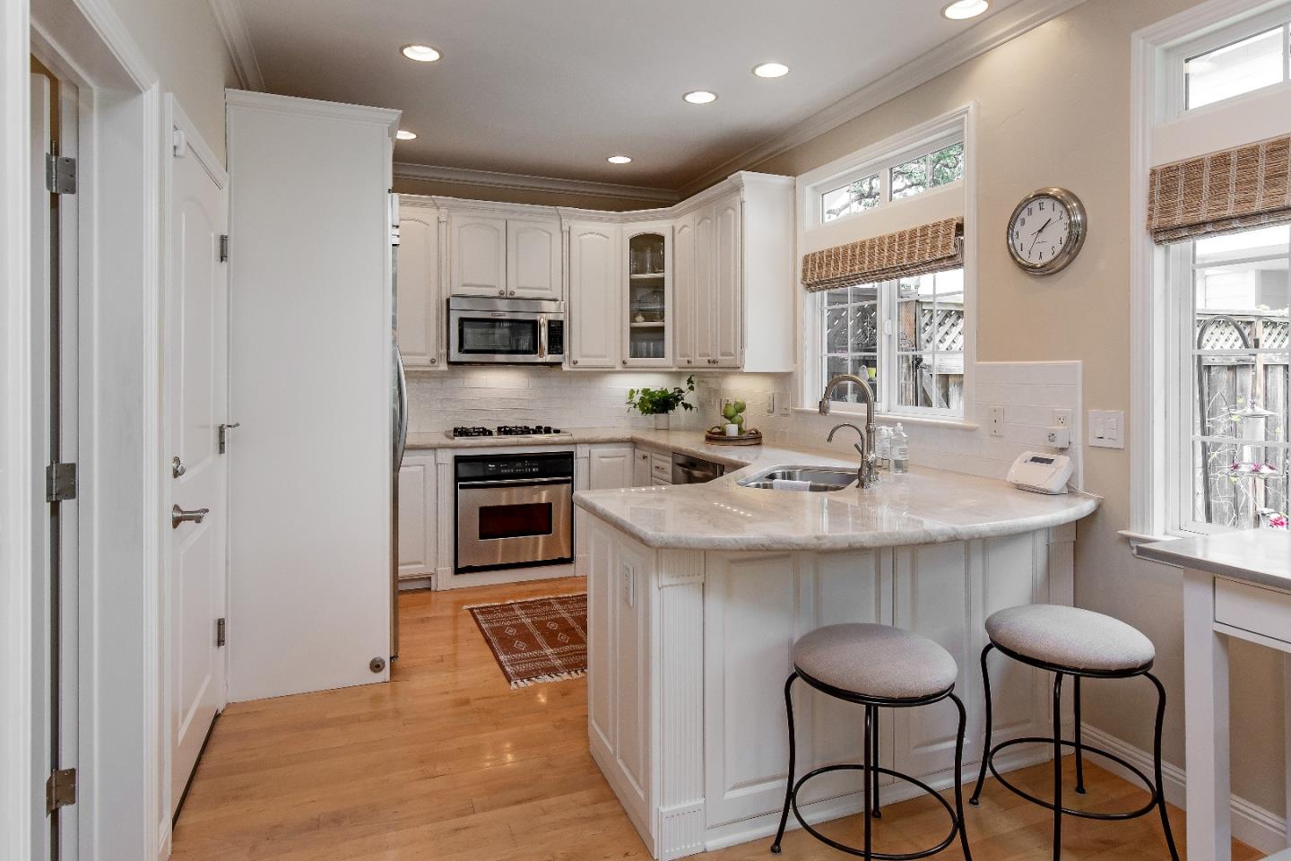 88 Forrest Avenue Los Gatos, CA 95032 - Photo 6 of 26 a kitchen with granite countertop a sink and stainless steel appliances
