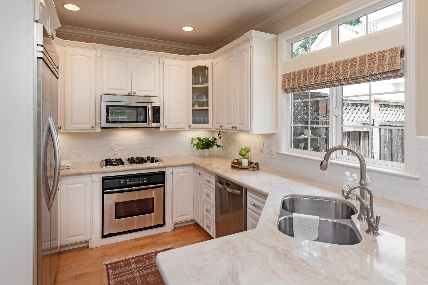 88 Forrest Avenue Los Gatos, CA 95032 - Photo 7 of 26 a kitchen with stainless steel appliances granite countertop a sink stove and microwave