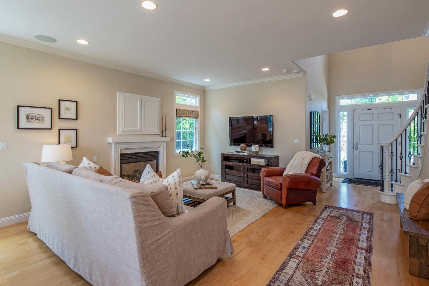 88 Forrest Avenue Los Gatos, CA 95032 - Photo 9 of 26 a living room with furniture a fireplace and a flat screen tv