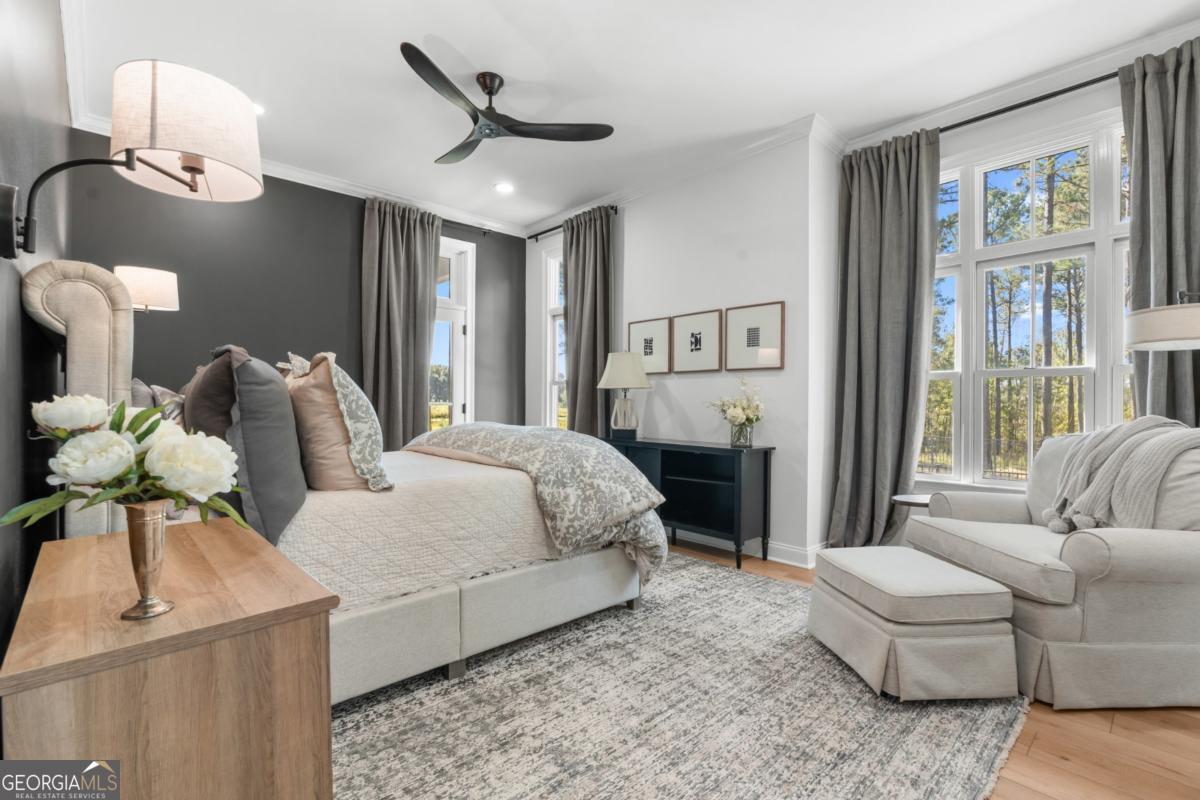 1951 Tru Fail Crossing Road Garfield, GA 30425 - Photo 11 of 49 a bedroom with a bed couch and window