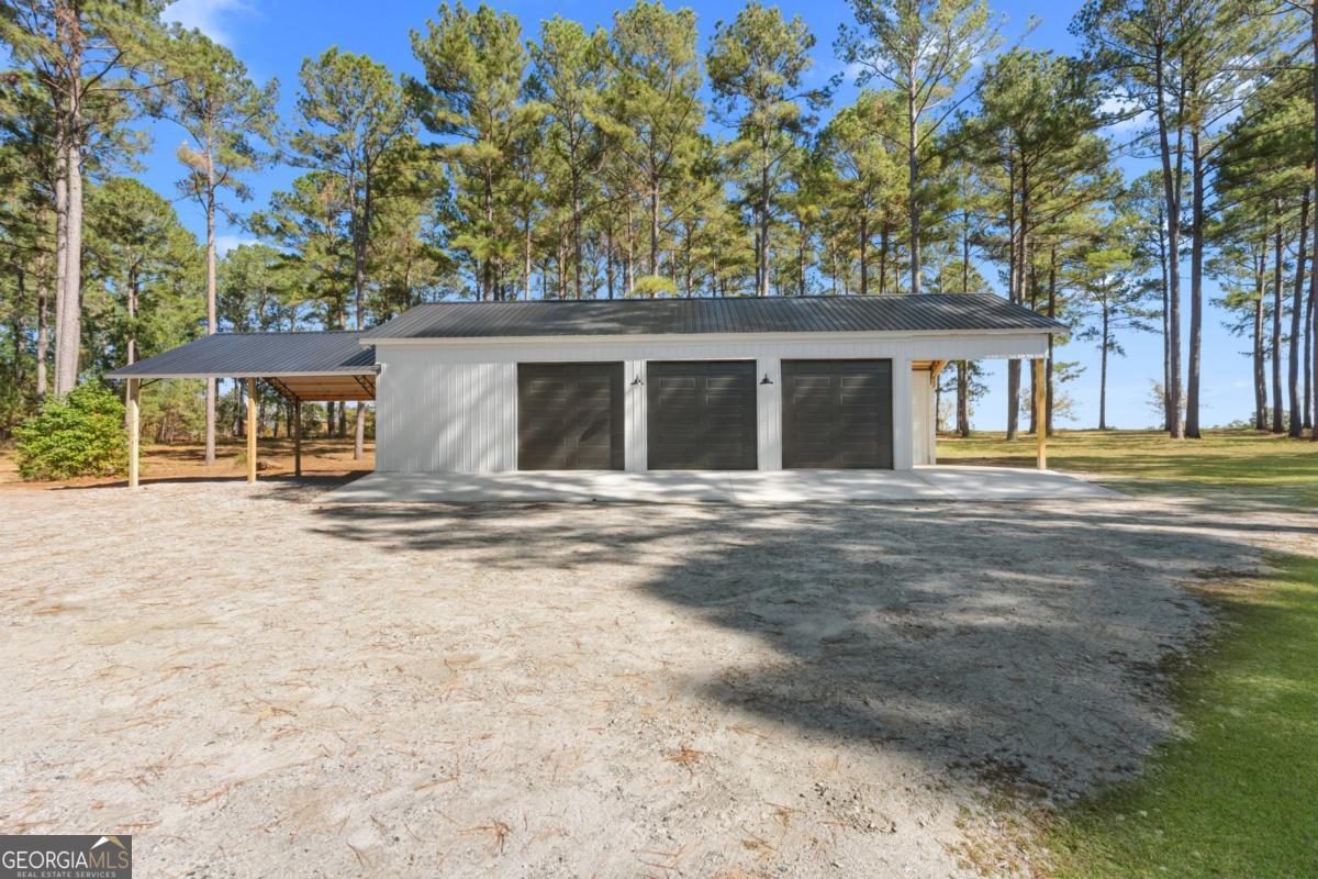 1951 Tru Fail Crossing Road Garfield, GA 30425 - Photo 3 of 49 front view of a house with a trees