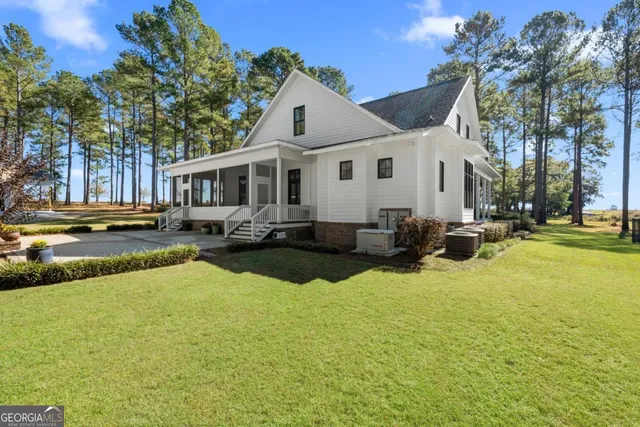 a swimming pool view with a outdoor seating
