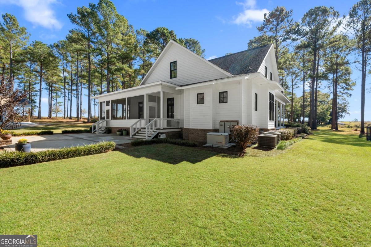 1951 Tru Fail Crossing Road Garfield, GA 30425 - Photo 33 of 49 a swimming pool view with a outdoor seating