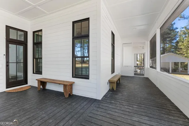 a view of an entryway with wooden floor and windows