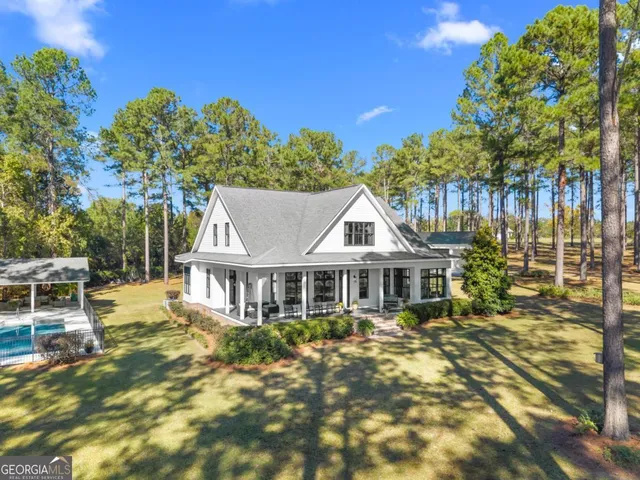 a house with palm tree in the background