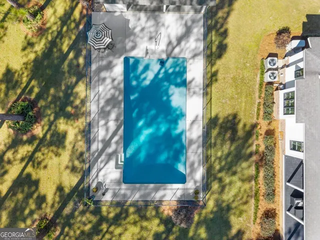 a view of a swimming pool with a patio