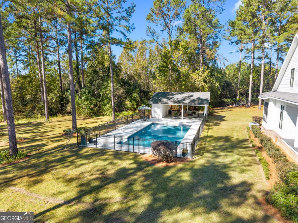 1951 Tru Fail Crossing Road Garfield, GA 30425 - Photo 48 of 49 a view of a swimming pool with a patio
