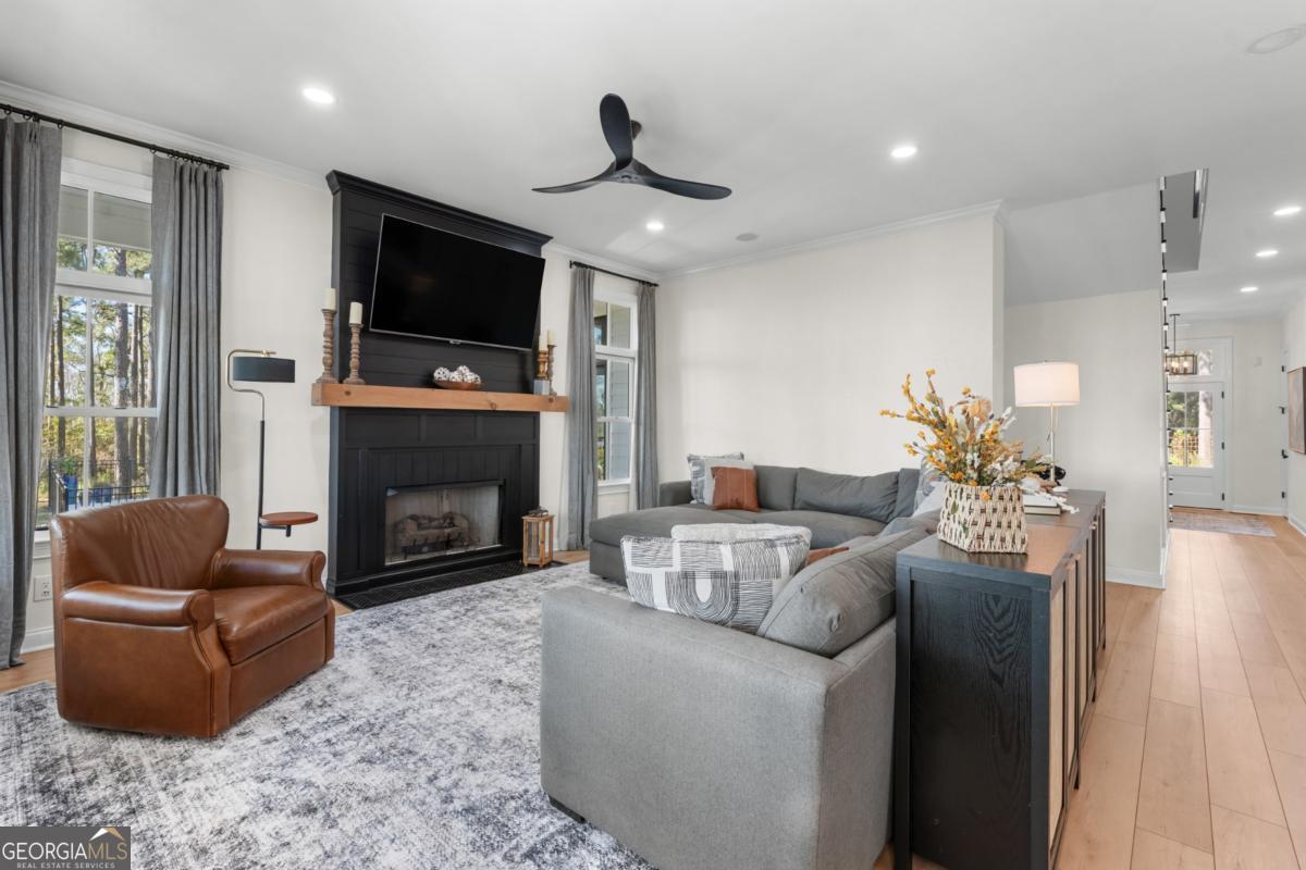 1951 Tru Fail Crossing Road Garfield, GA 30425 - Photo 6 of 49 a living room with furniture fireplace and flat screen tv