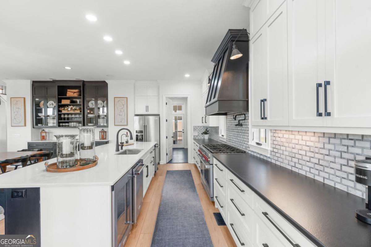 1951 Tru Fail Crossing Road Garfield, GA 30425 - Photo 9 of 49 a kitchen with counter top space a sink and appliances