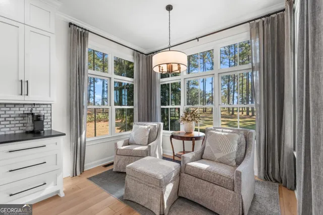 a living room with furniture and windows