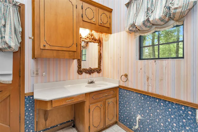 a bathroom with a bathtub and shower