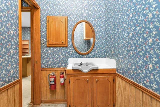a view of a porch with wooden floor and fence
