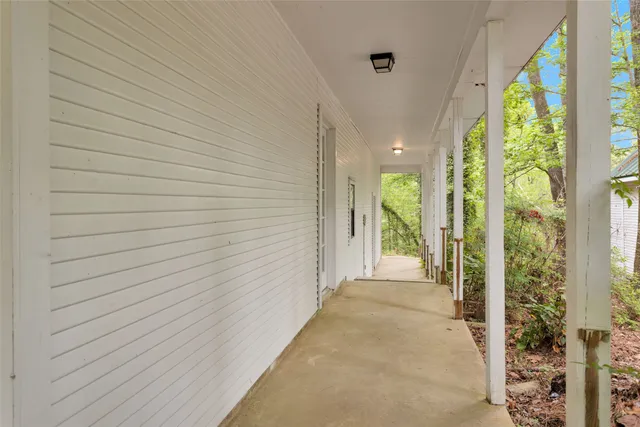 a view of a pathway both side of house