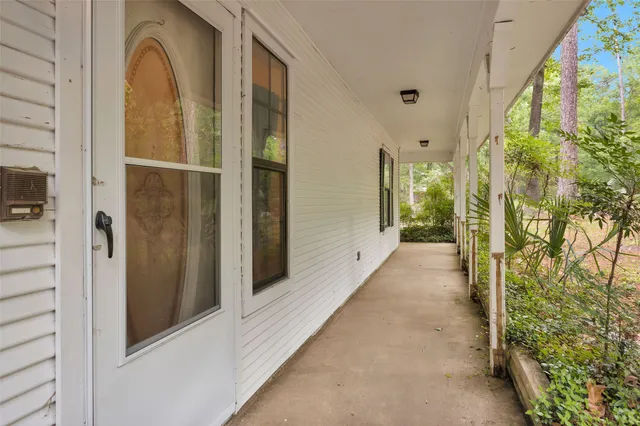 a view of a bathroom from a hallway