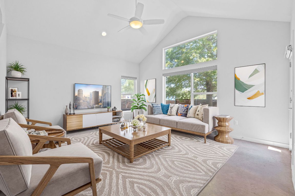 a living room with furniture and a large window