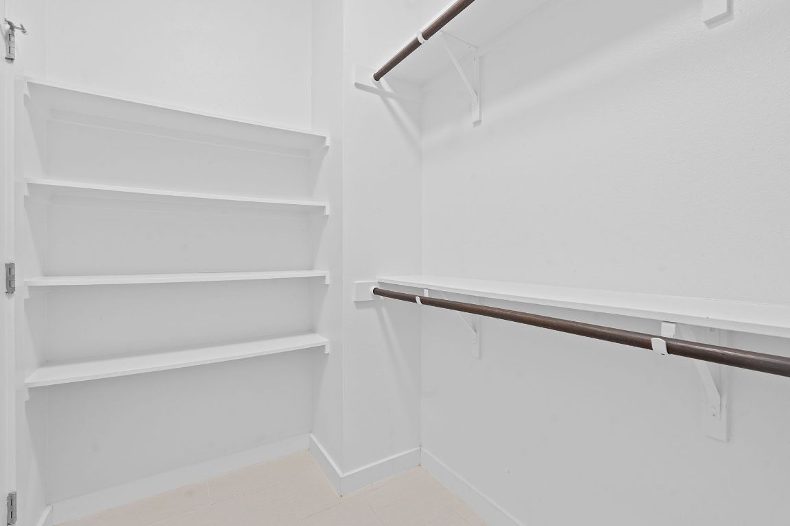 301 West Stassney Lane, Unit 7 Austin, TX 78745 - Photo 20 of 30 a view of walk in closet with empty racks