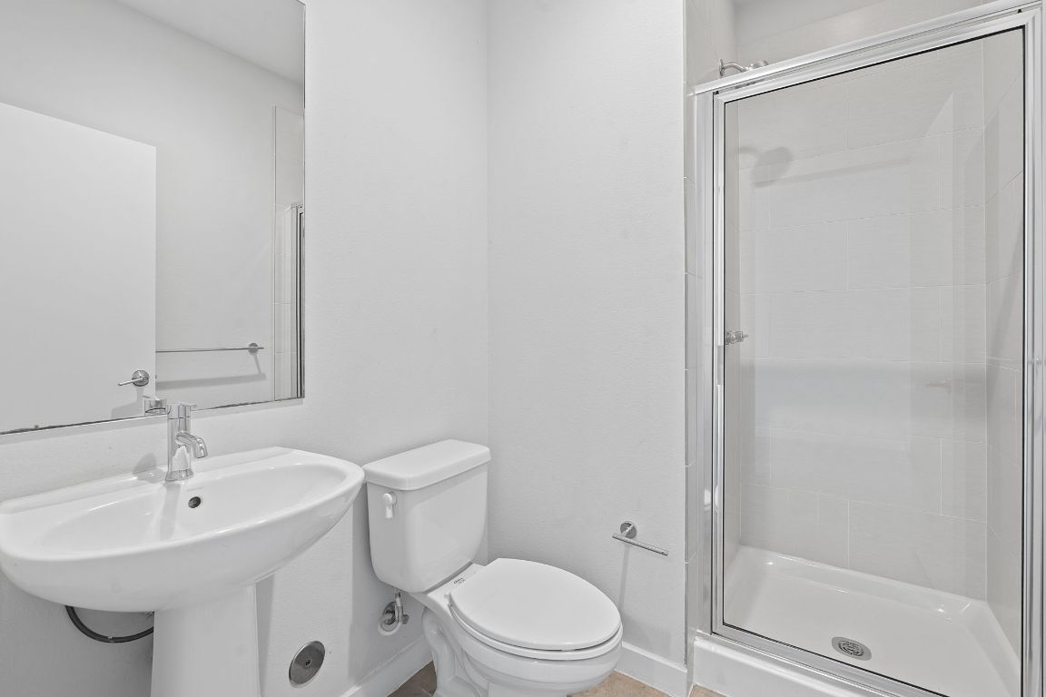 301 West Stassney Lane, Unit 7 Austin, TX 78745 - Photo 26 of 30 a bathroom with a sink toilet and shower