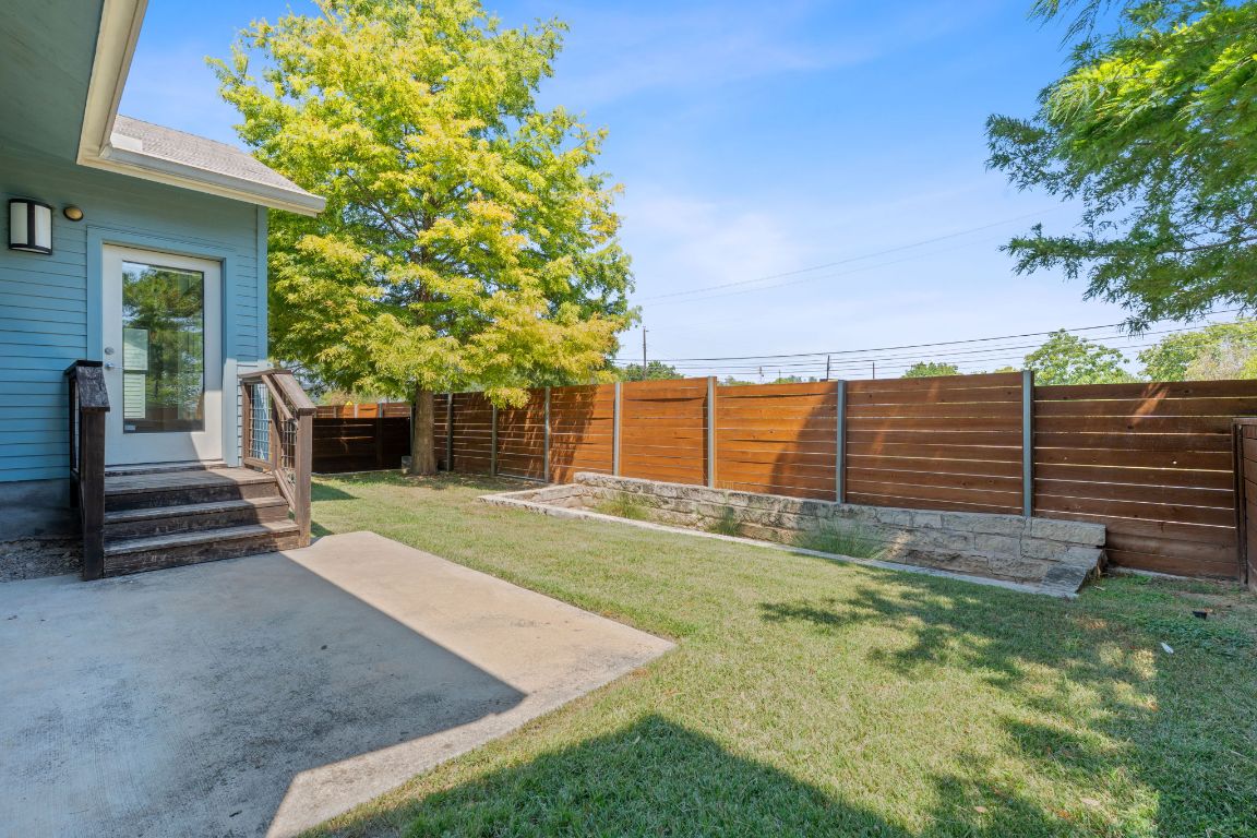 301 West Stassney Lane, Unit 7 Austin, TX 78745 - Photo 28 of 30 a view of a backyard with wooden fence