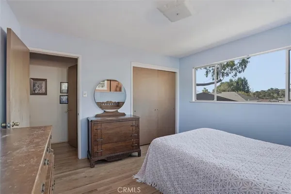 a bedroom with a bed and cabinets